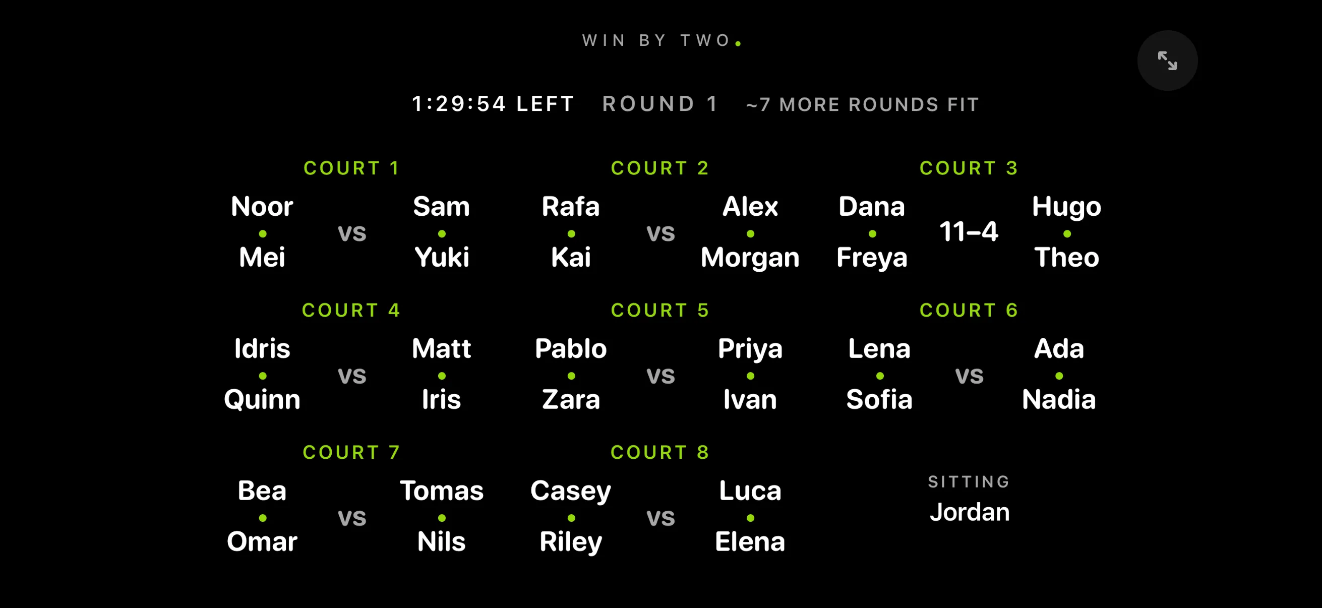 The walk-up board on a phone held sideways: round 1, 1:15 left, eight courts in three columns with the players on each, and who’s sitting